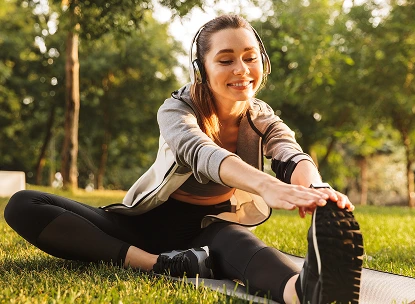 woman stretching in the park